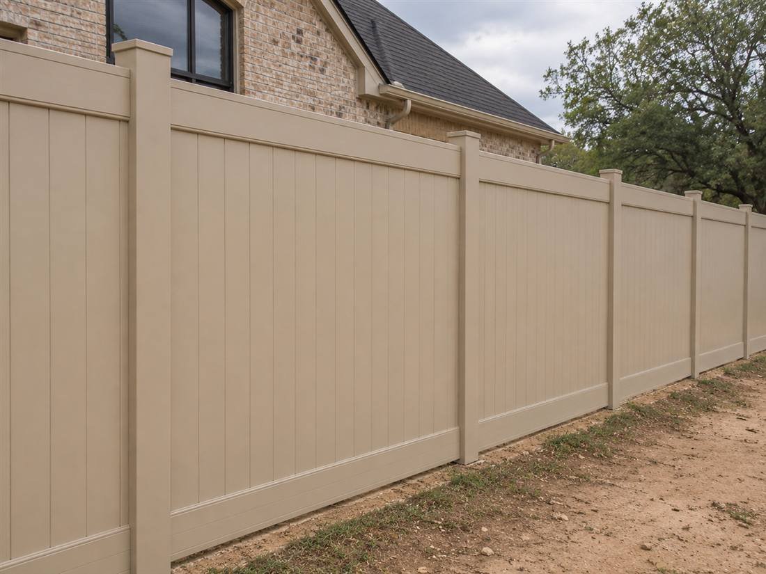 Tan vinyl privacy fence installed in Plano, TX